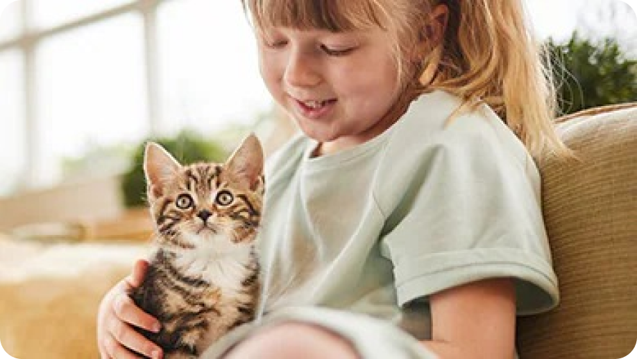 Girl With Happy kitten on her lap